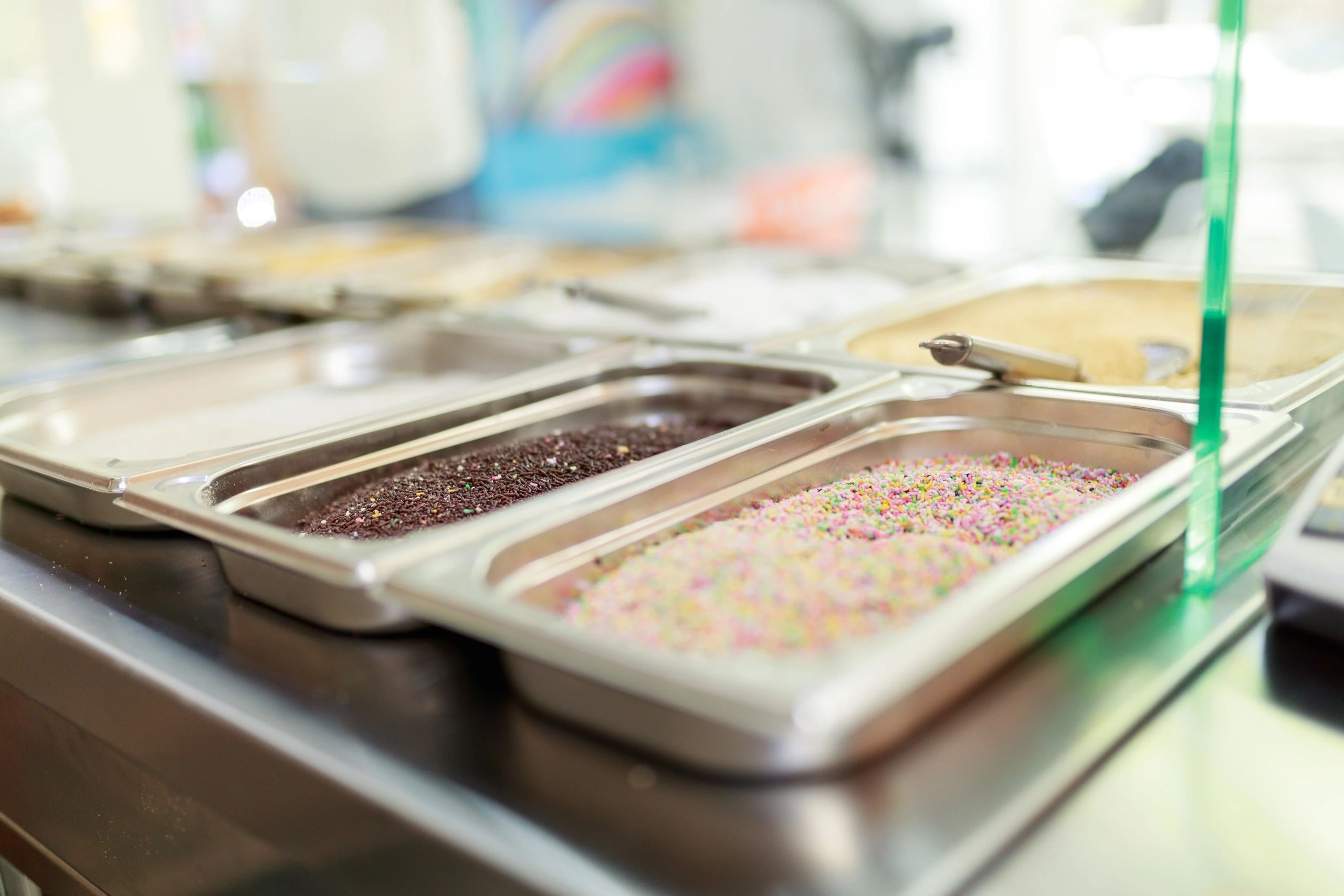 Assortment of dessert toppings in containers