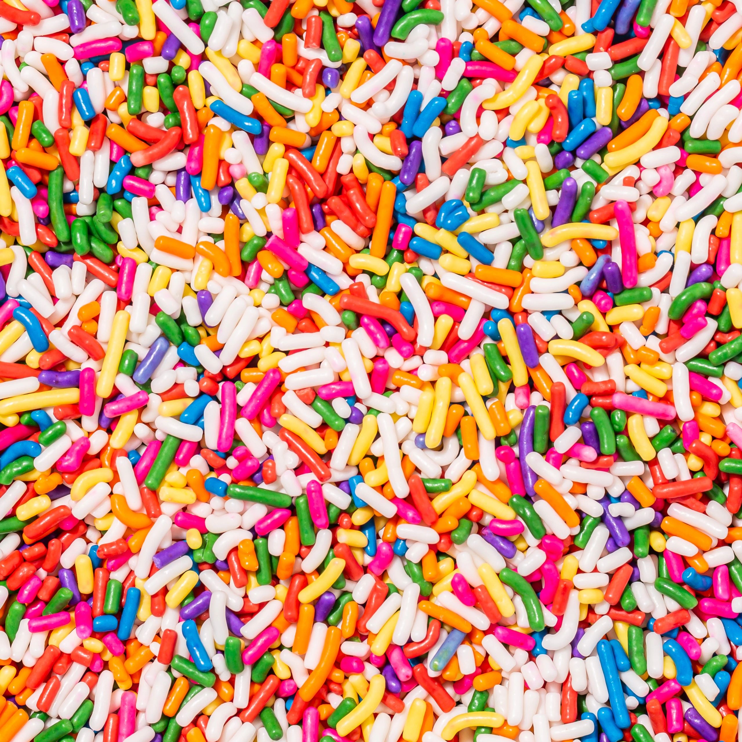 Pink sprinkle texture suggesting strawberry sprinkle topping.