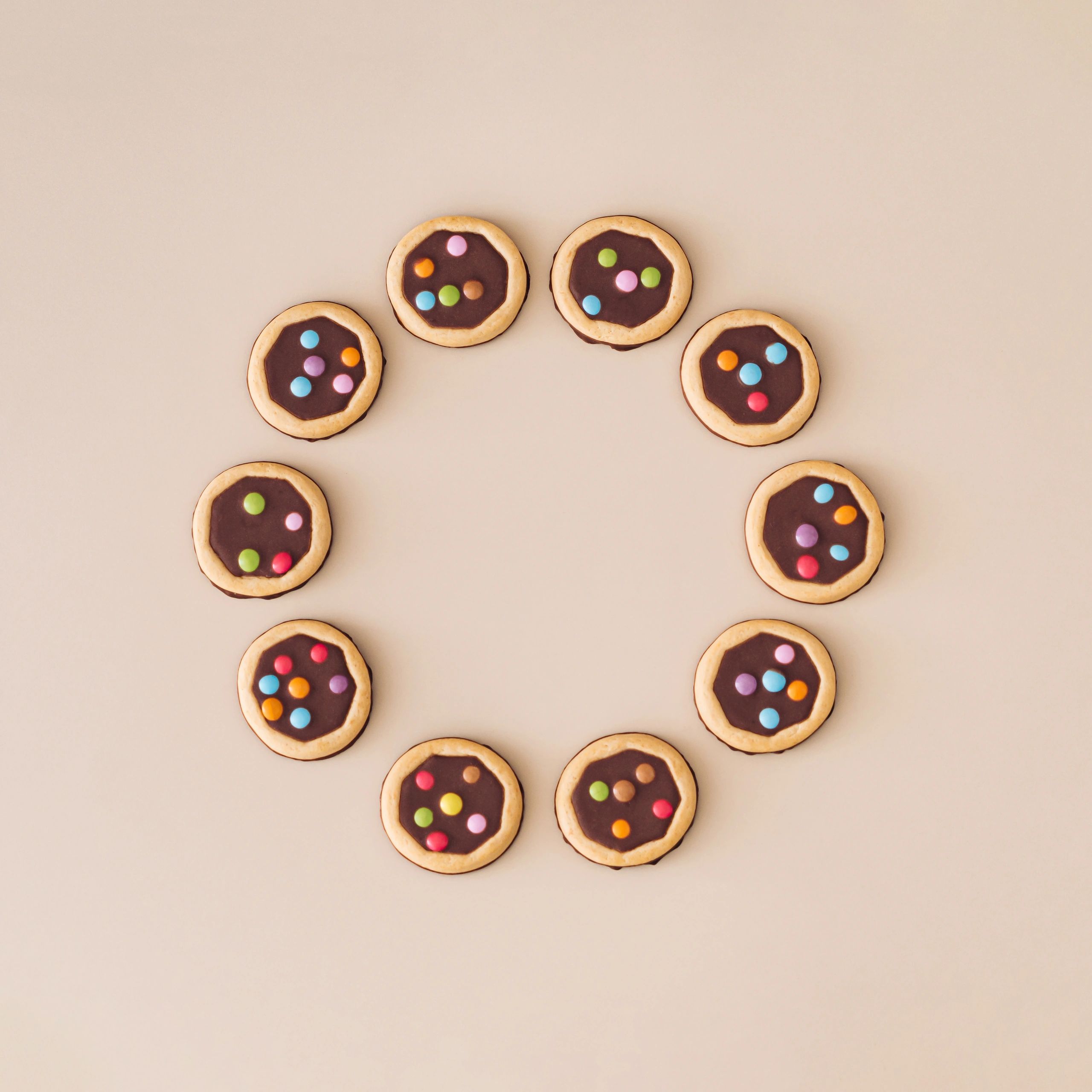 Colorful toppings and sweets arranged on a bright background